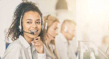 Call center worker accompanied by her team.